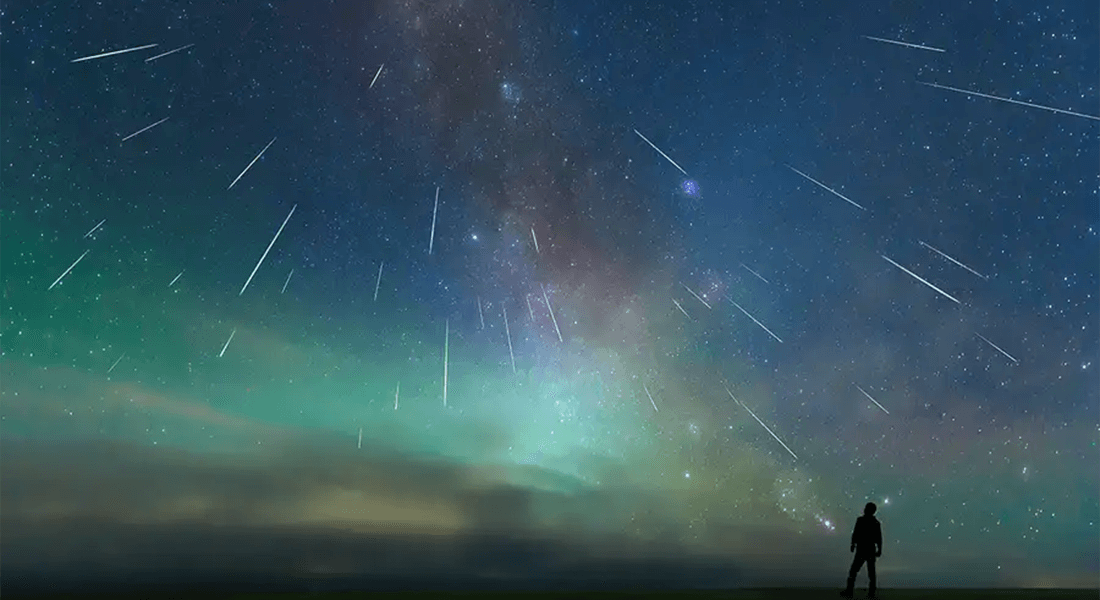 Downpour of micrometeorites on colorful night sky.