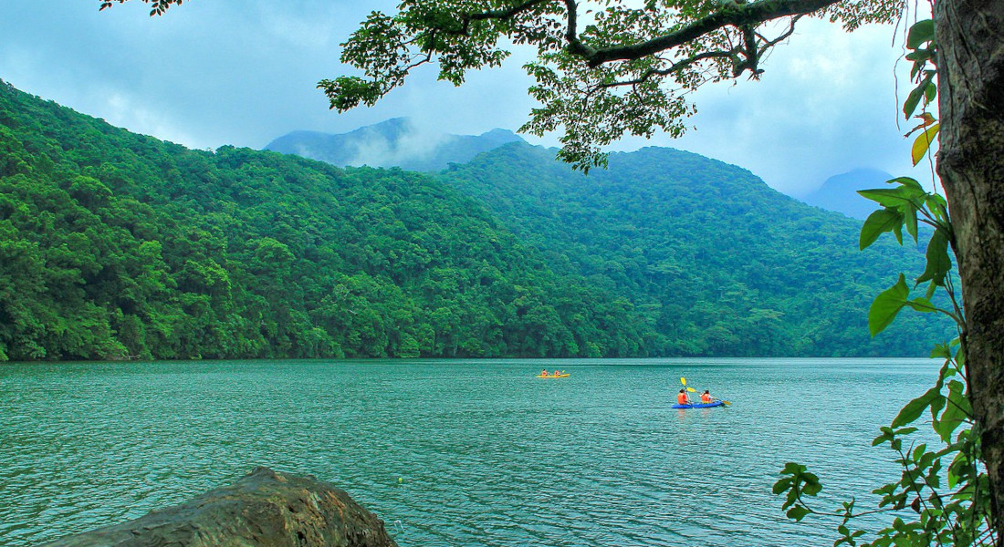 People kayaking at Bulusan Lake in the northern Philippines
